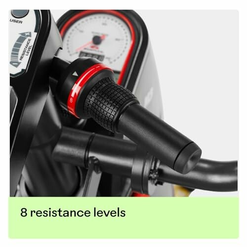 Close-up of exercise bike resistance knob with 8 resistance levels displayed.