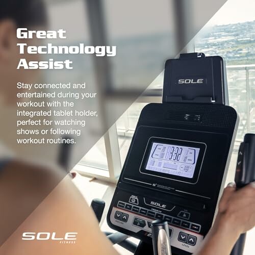 Sole fitness treadmill with tablet holder and display panel.